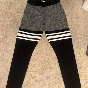 Never Worn Bombshell Sportswear Black and Gray Leggings with Color-Block Design